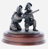 hand crafted 8" scale statuette of crouching Firefighters laying foam with a Branch.. Handmade in bronze cold cast resin.
