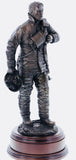 This statue is sculpted to show a firefighter having taken his helmet and BA mask off, worn out after fighting a fire.
