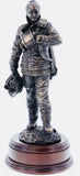 hand crafted 12" scale statuette of a woman Firefighter at the end of a 'Fire Call'.