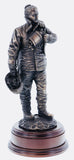 hand crafted 12" scale statuette of a woman Firefighter at the end of a 'Fire Call'.