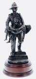 firefighter in the 80s carrying an unconscious victim from a burning building in a similar pose to that of the 'Saved' firefighter of Victorian Era painted by Charles Vigour which is displayed in the Fire Service Technical College at Moreton-in-Marsh
