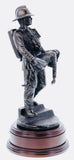 firefighter in the 80s carrying an unconscious victim from a burning building in a similar pose to that of the 'Saved' firefighter of Victorian Era painted by Charles Vigour which is displayed in the Fire Service Technical College at Moreton-in-Marsh