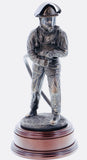 hand crafted 11" scale statuette of a Firefighter undertaking firefighting duties with a charged branch. Handmade in bronze cold cast resin.