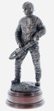 hand crafted 11" scale statuette of a Firefighter about to undertake rescue operations at a Road Traffic Collision (RTC). The 'Jaws of Life' is the nickname given by firefighters to large scale cutting & spreading equipment which is designed to release accident victims from their vehicles. These highly powerful tools are normally hydraulically charged and over the years, have saved thousands of lives. Handmade in bronze cold cast resin.