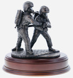 hand crafted 8" scale statuette of Firefighters tackling a fire on a branch wearing modern Cromwell F600 helmets. Handmade in bronze cold cast resin.