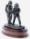 hand crafted 8" scale statuette of Firefighters tackling a fire on a branch wearing modern Cromwell F600 helmets. Handmade in bronze cold cast resin.