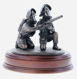 hand crafted 8" scale statuette of crouching Firefighters laying foam with a Branch.. Handmade in bronze cold cast resin. 