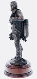 This statue is sculpted to show a firefighter having taken his helmet and BA mask off, worn out after fighting a fire.