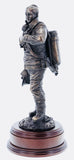hand crafted 12" scale statuette of a woman Firefighter at the end of a 'Fire Call'.