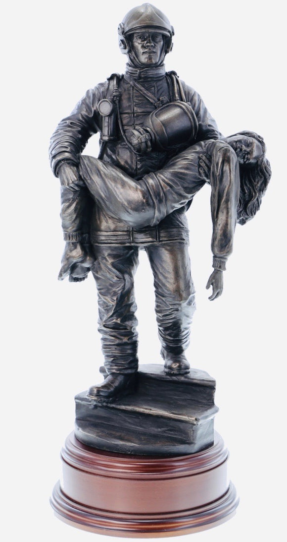 firefighter in the modern period carrying an unconscious victim from a burning building in a similar pose to that of the 'Saved' firefighter of Victorian Era painted by Charles Vigour which is displayed in the Fire Service Technical College at Moreton-in-Marsh. 