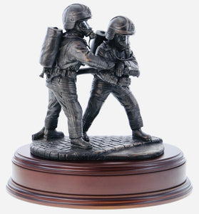 hand crafted 8" scale statuette of Firefighters tackling a fire on a branch wearing modern Cromwell F600 helmets. Handmade in bronze cold cast resin. 