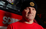 Elasticated woolly beanie hat in black sporting the gold FBU logo in the Fire Service Star stitched on the front
